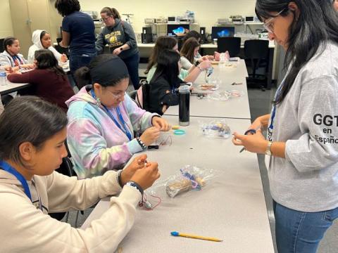 Syracuse City School District 8th grade girls made binary bracelets during Girls Going Tech Espanol on the Onondaga Community College campus.